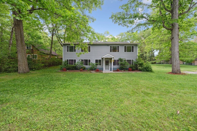 6544 Woodland Rd, Whitmore Lake, MI 48189 - colonial house featuring a front lawn
