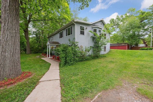 6544 Woodland Rd, Whitmore Lake, MI 48189 - view of side of property featuring a lawn