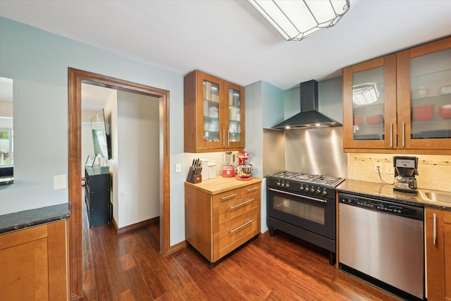 6544 Woodland Rd, Whitmore Lake, MI 48189 - kitchen featuring appliances with stainless steel finishes, wall chimney range hood, dark wood-style flooring, and brown cabinetry