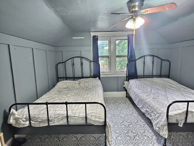 5014 Ford St, Swartz Creek, MI 48473 - bedroom featuring a decorative wall, vaulted ceiling, and ceiling fan