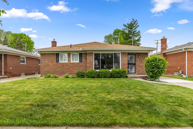 8903 Appleton, Redford, MI 48239 - view of front of home with brick siding, a chimney, and a front lawn