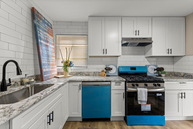 8903 Appleton, Redford, MI 48239 - kitchen featuring dishwasher, under cabinet range hood, stainless steel gas stove, a sink, and light wood-style floors