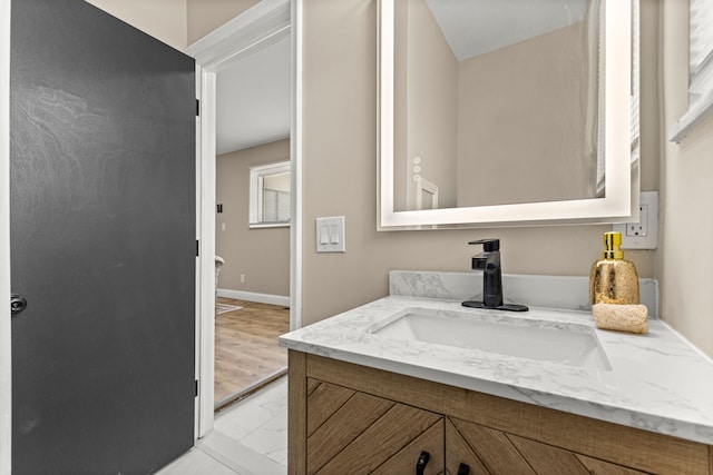 8903 Appleton, Redford, MI 48239 - bathroom featuring marble finish flooring, vanity, baseboards, and toilet