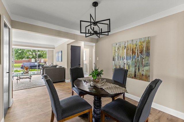 8903 Appleton, Redford, MI 48239 - dining space with a chandelier, light wood-style floors, and baseboards