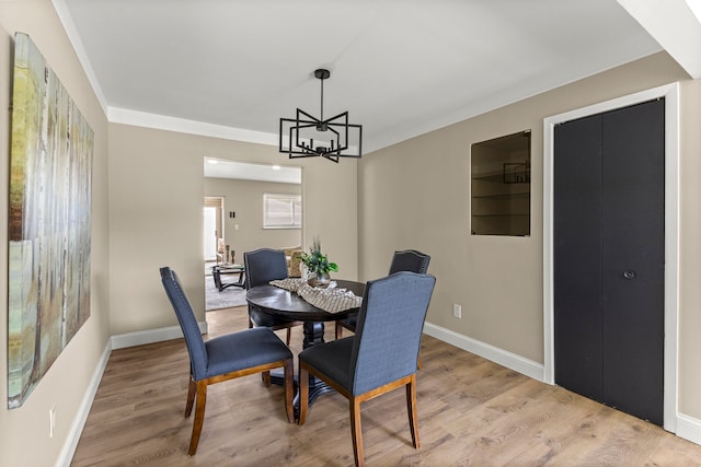 8903 Appleton, Redford, MI 48239 - dining area with light wood finished floors, a chandelier, and baseboards