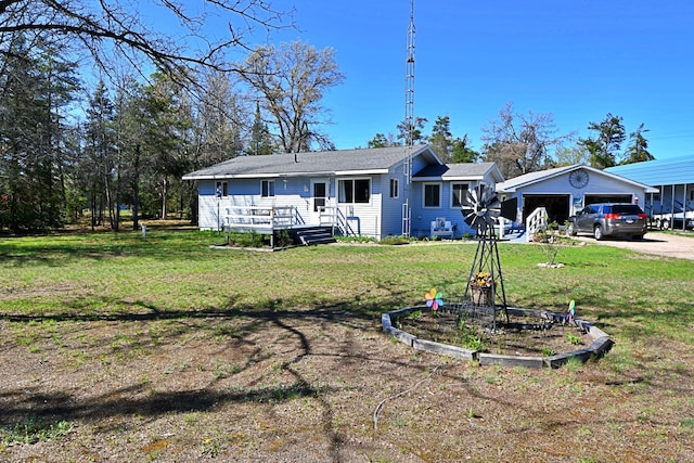 2741 E M 72, Grayling, MI 49738 - back of house featuring a lawn and driveway
