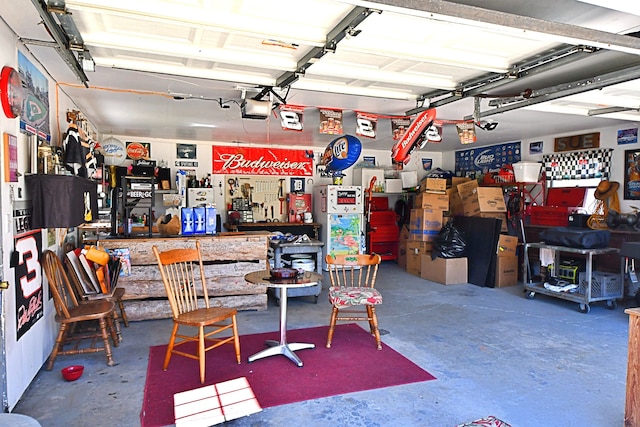 2741 E M 72, Grayling, MI 49738 - garage featuring a workshop area and a garage door opener