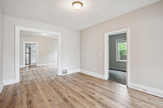 533 W Ganson St, Jackson, MI 49201 - unfurnished room featuring light wood finished floors and baseboards