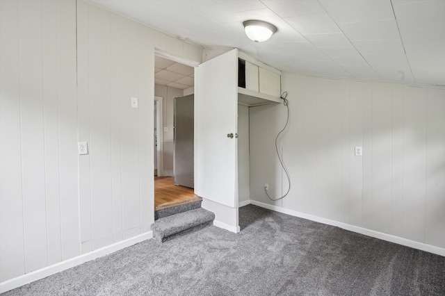 533 W Ganson St, Jackson, MI 49201 - below grade area featuring freestanding refrigerator, carpet, and baseboards