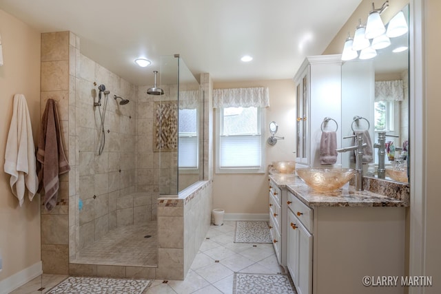 7708 Stations Dr SW, Byron Center, MI 49315 - bathroom featuring baseboards, vanity, walk in shower, plenty of natural light, and recessed lighting