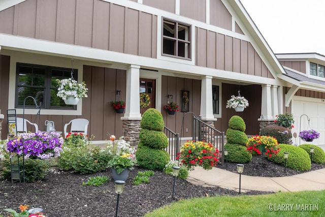 7708 Stations Dr SW, Byron Center, MI 49315 - doorway to property featuring covered porch and board and batten siding