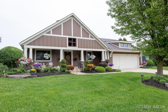 7708 Stations Dr SW, Byron Center, MI 49315 - craftsman inspired home with driveway, covered porch, a front yard, and roof with shingles