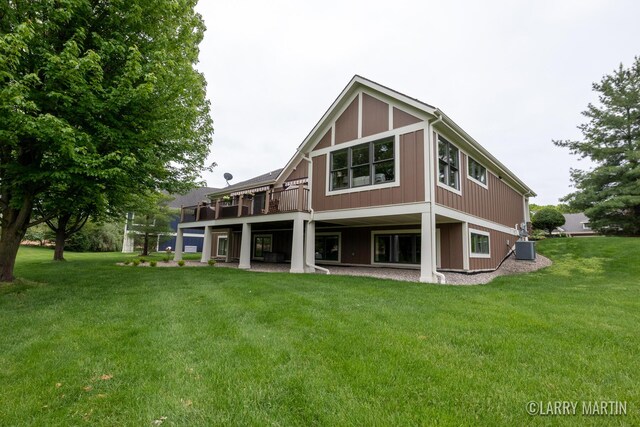 7708 Stations Dr SW, Byron Center, MI 49315 - back of house featuring a yard, central air condition unit, and a wooden deck
