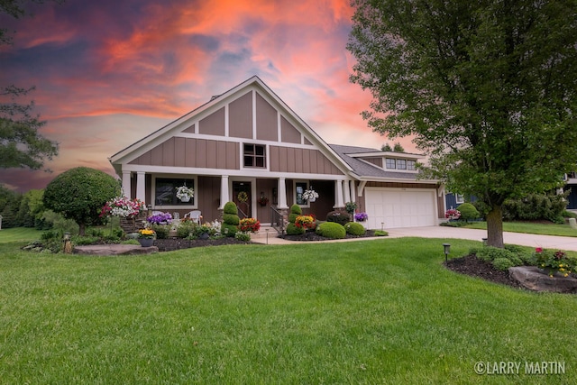 7708 Stations Dr SW, Byron Center, MI 49315 - craftsman-style house featuring covered porch, a yard, concrete driveway, and board and batten siding