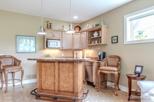 7708 Stations Dr SW, Byron Center, MI 49315 - bar featuring stainless steel microwave, baseboards, and decorative light fixtures