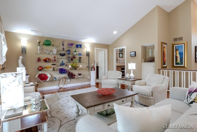 7708 Stations Dr SW, Byron Center, MI 49315 - living area featuring wood finished floors, high vaulted ceiling, baseboards, and recessed lighting