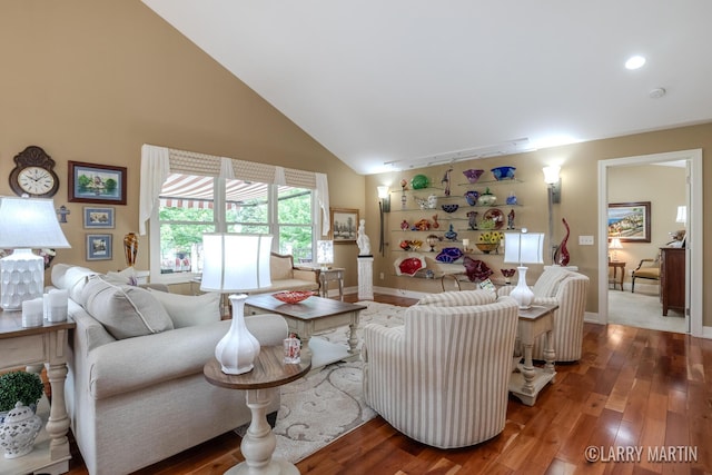 7708 Stations Dr SW, Byron Center, MI 49315 - living area featuring wood finished floors, high vaulted ceiling, and baseboards