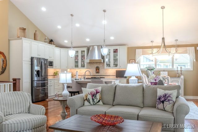 7708 Stations Dr SW, Byron Center, MI 49315 - living area featuring wood finished floors, recessed lighting, and lofted ceiling