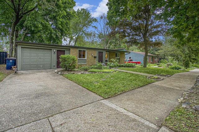 2753 Cumberland Ave, Ann Arbor, MI 48104 - ranch-style home featuring concrete driveway, a garage, a front yard, and brick siding