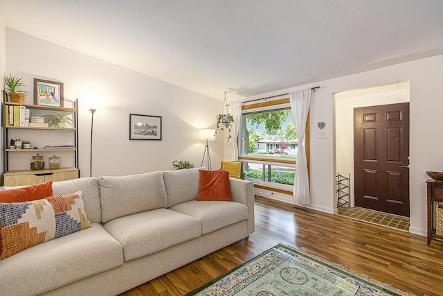 2753 Cumberland Ave, Ann Arbor, MI 48104 - living room featuring wood finished floors, lofted ceiling, and baseboards