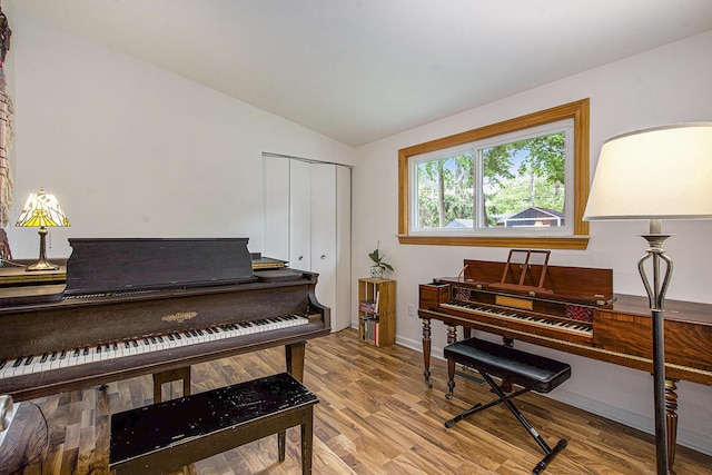 2753 Cumberland Ave, Ann Arbor, MI 48104 - living area featuring light wood-type flooring, vaulted ceiling, and baseboards