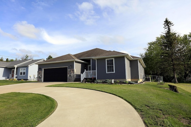113 Davis Dr, Brooklyn, MI 49230 - view of front of house with concrete driveway, an attached garage, and a front yard