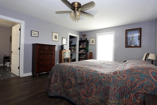 113 Davis Dr, Brooklyn, MI 49230 - bedroom with dark wood-style floors, baseboards, and a ceiling fan