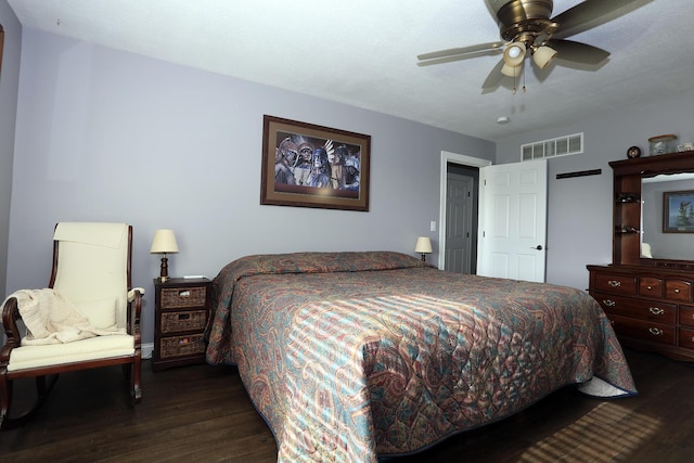 113 Davis Dr, Brooklyn, MI 49230 - bedroom with dark wood-style floors and a ceiling fan
