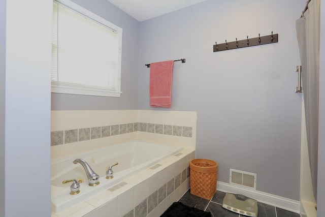 113 Davis Dr, Brooklyn, MI 49230 - full bath with a bath, tile patterned flooring, and baseboards