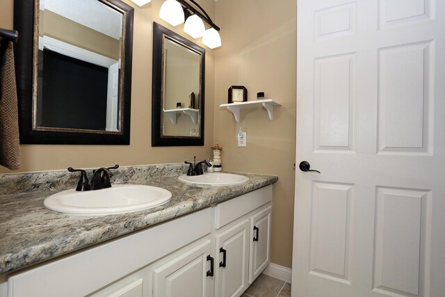 113 Davis Dr, Brooklyn, MI 49230 - bathroom with double vanity and tile patterned floors