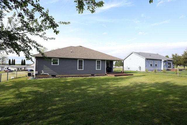 113 Davis Dr, Brooklyn, MI 49230 - rear view of house with a wooden deck and a shingled roof
