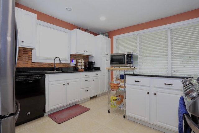 113 Davis Dr, Brooklyn, MI 49230 - kitchen featuring a sink, stainless steel appliances, white cabinets, backsplash, and recessed lighting