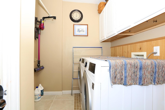 113 Davis Dr, Brooklyn, MI 49230 - laundry area with cabinet space, washer and dryer, baseboards, and light tile patterned floors
