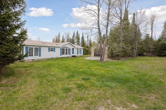 9168 Clewley Rd, Lachine, MI 49753 - view of front facade with crawl space and a front yard
