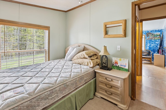 9168 Clewley Rd, Lachine, MI 49753 - bedroom featuring ornamental molding