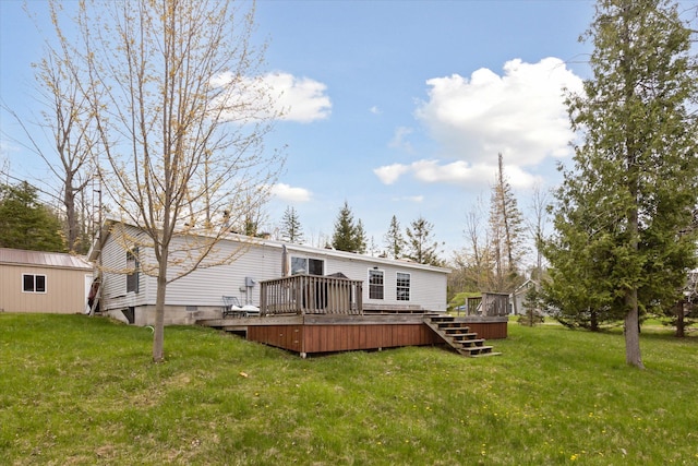 9168 Clewley Rd, Lachine, MI 49753 - rear view of house with a deck and a lawn