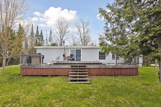 9168 Clewley Rd, Lachine, MI 49753 - rear view of property with a yard and a deck