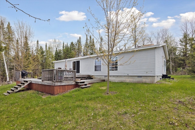 9168 Clewley Rd, Lachine, MI 49753 - rear view of property with a deck, a lawn, and crawl space