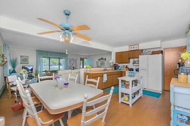 65805 S St, Cassopolis, MI 49031 - dining area featuring light wood-type flooring and a ceiling fan