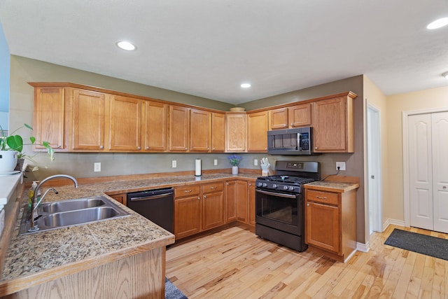24346 Vargas Dr, Mattawan, MI 49071 - kitchen featuring gas stove, dishwashing machine, a sink, light wood-type flooring, and recessed lighting