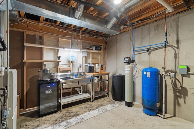 24346 Vargas Dr, Mattawan, MI 49071 - unfinished basement with a water pressure tank and a water softener system
