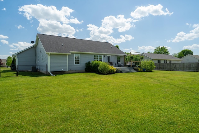24346 Vargas Dr, Mattawan, MI 49071 - rear view of house with cooling unit, a deck, and roof with shingles