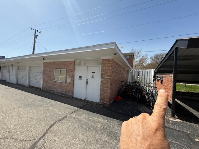1233 Island Dr Unit 203, Ann Arbor, MI 48105 - view of front of property featuring brick siding