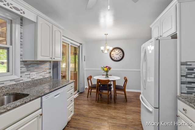 756 66th St SE, Grand Rapids, MI 49548 - kitchen featuring white appliances, healthy amount of natural light, backsplash, and white cabinetry