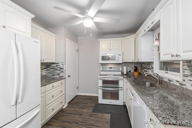 756 66th St SE, Grand Rapids, MI 49548 - kitchen with white appliances, a sink, tasteful backsplash, ceiling fan, and dark stone counters