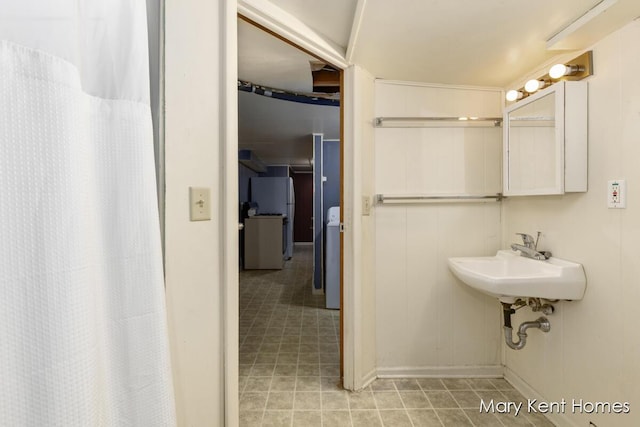 756 66th St SE, Grand Rapids, MI 49548 - bathroom with a sink and baseboards