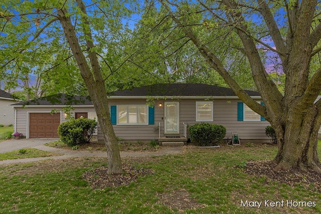 756 66th St SE, Grand Rapids, MI 49548 - view of front of property featuring a garage, driveway, and a front yard