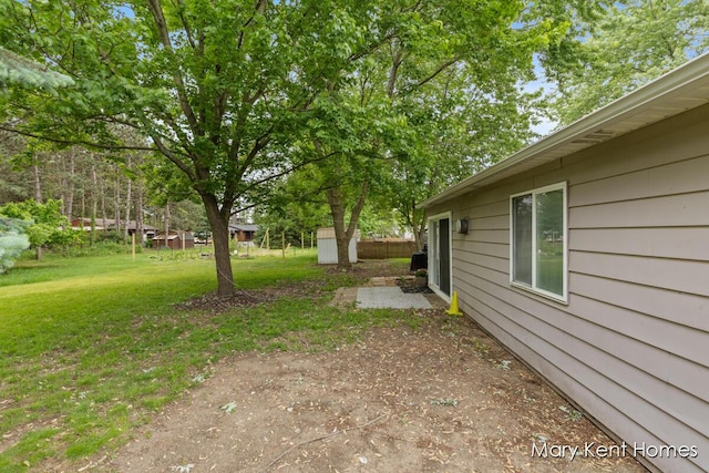 756 66th St SE, Grand Rapids, MI 49548 - view of green lawn with a patio area
