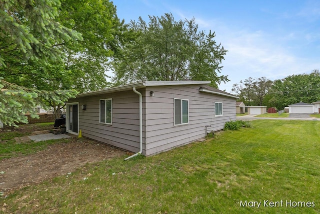 756 66th St SE, Grand Rapids, MI 49548 - view of property exterior with a yard