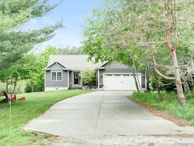 5076 Birch Ave, Lexington, MI 48450 - ranch-style home featuring driveway, a front yard, and an attached garage